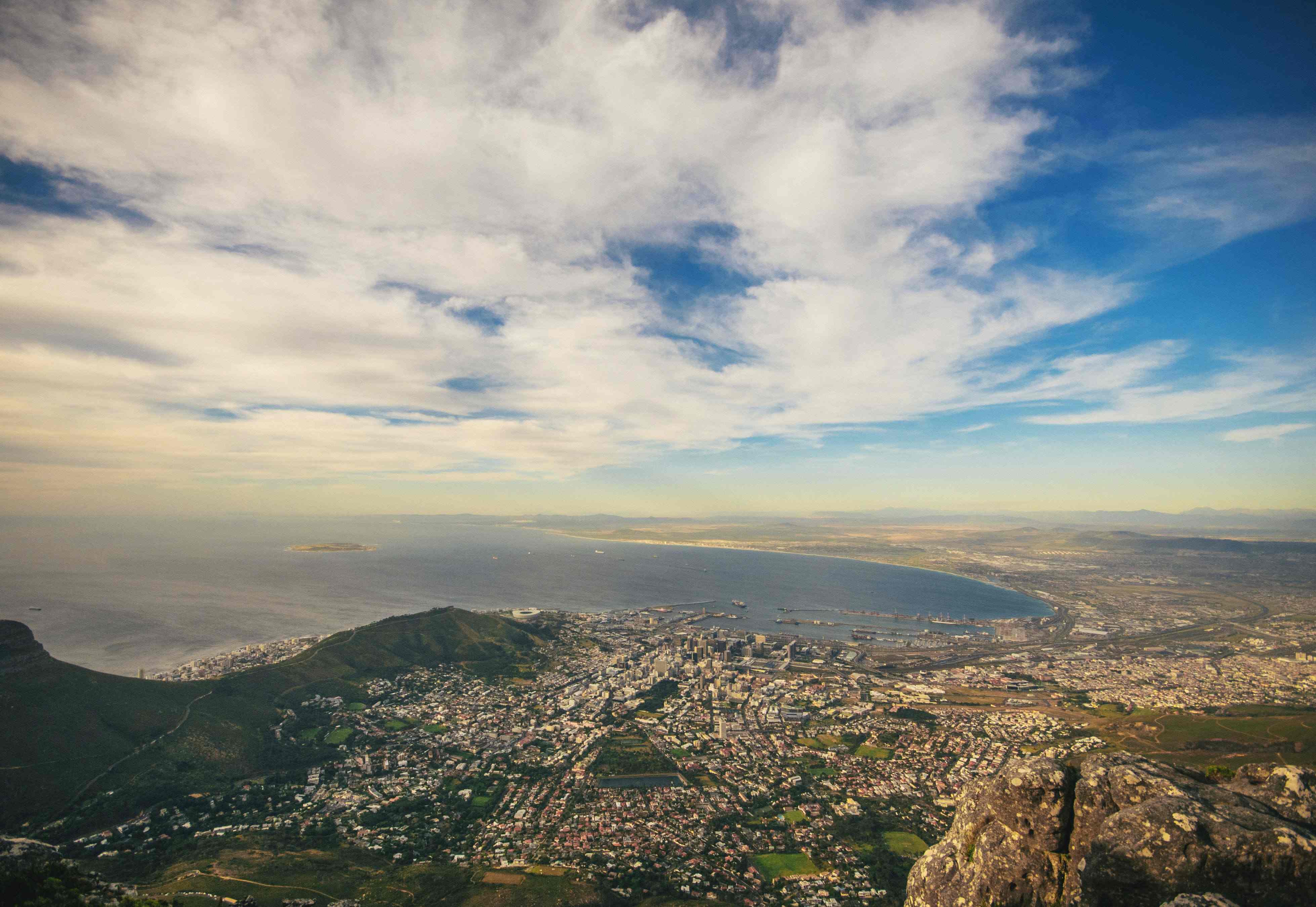 huge city with on mountainous terrain and bay