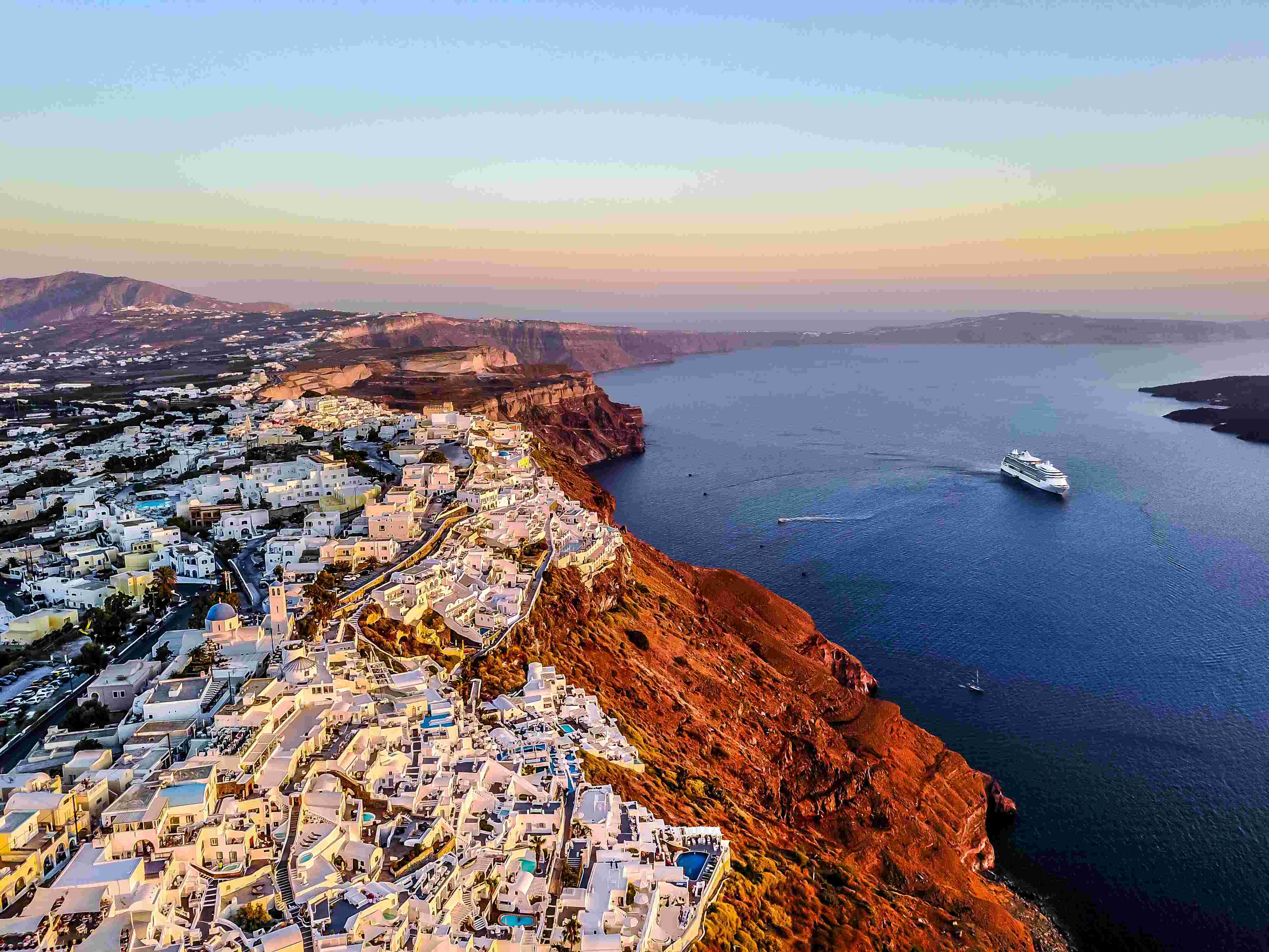 greek island with white houses on cliff