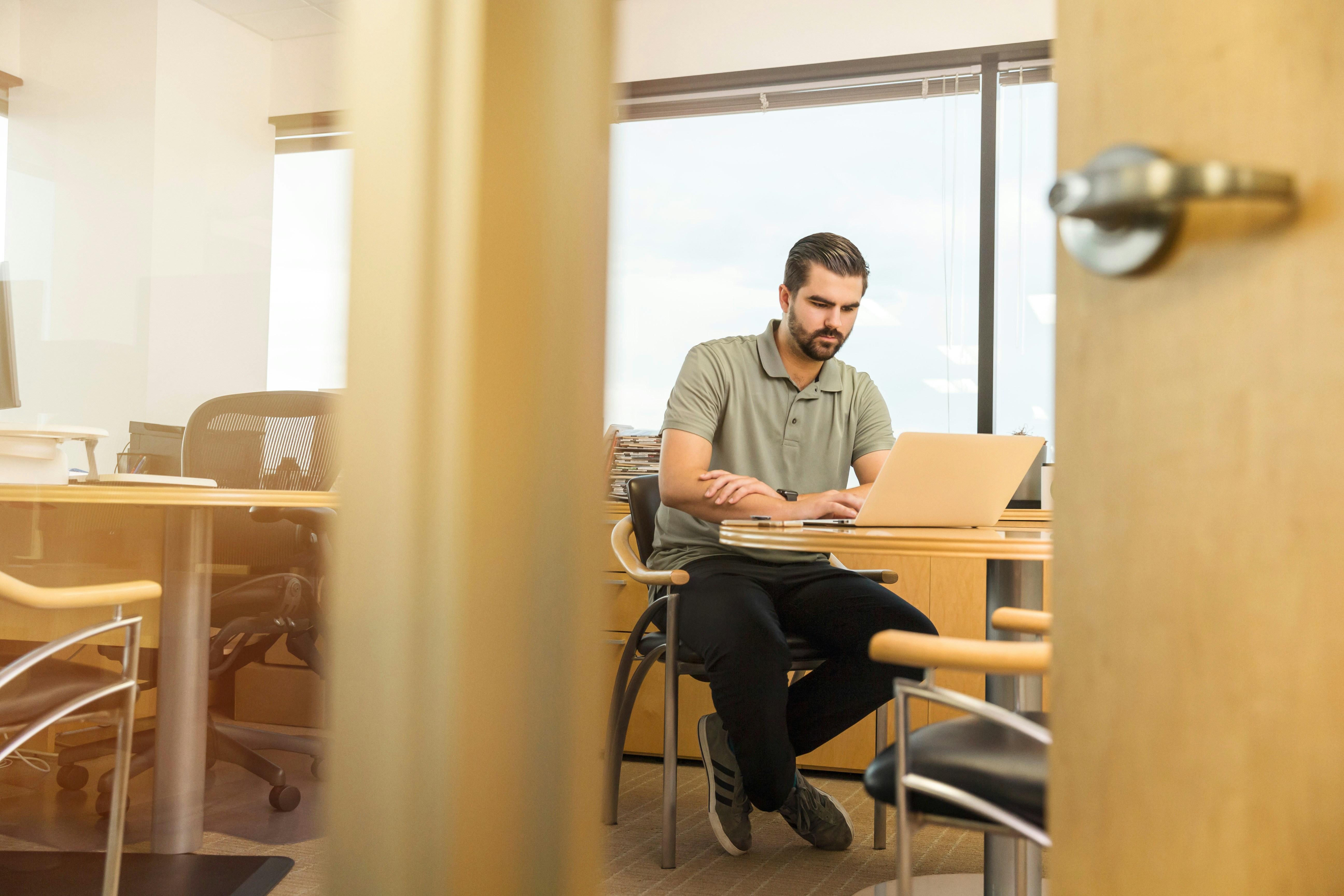 A man is looking at the laptop