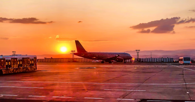 airport at sunset with pink colors shining