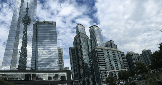 building reflected in buildings windows