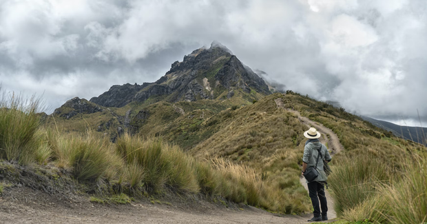 backpacker hiking a mountain