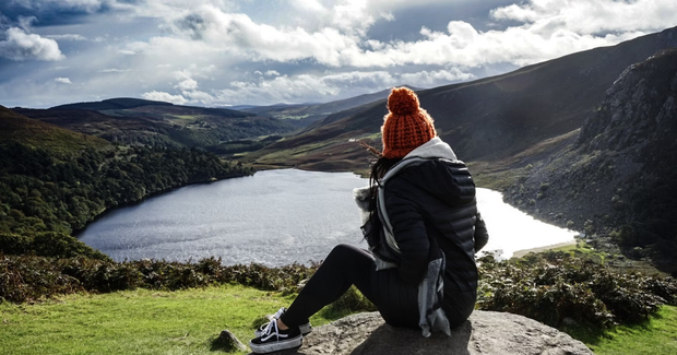 girl overlooking loch from a cliff