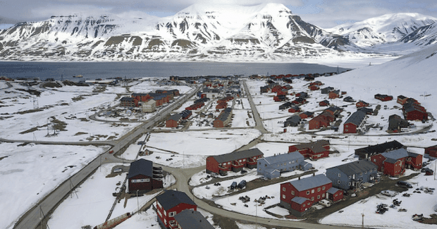 mountains in background of town