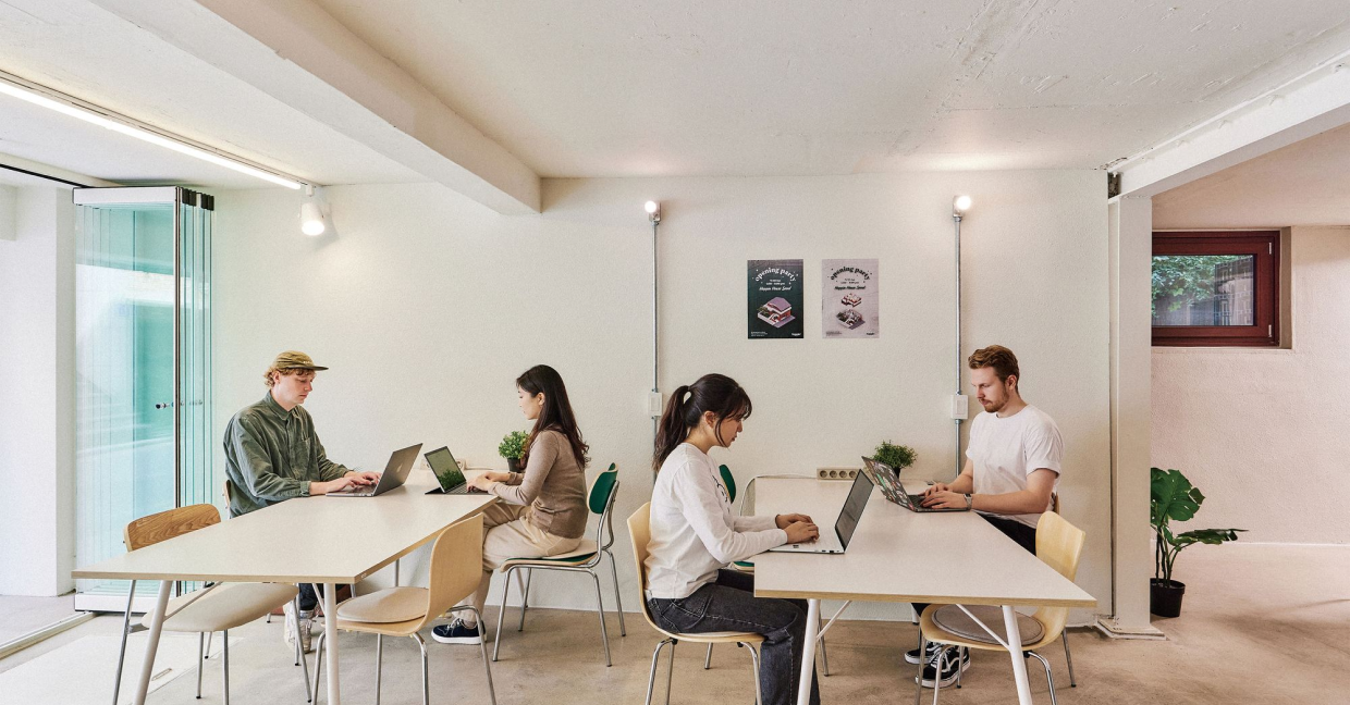 People in the coworking space with laptops